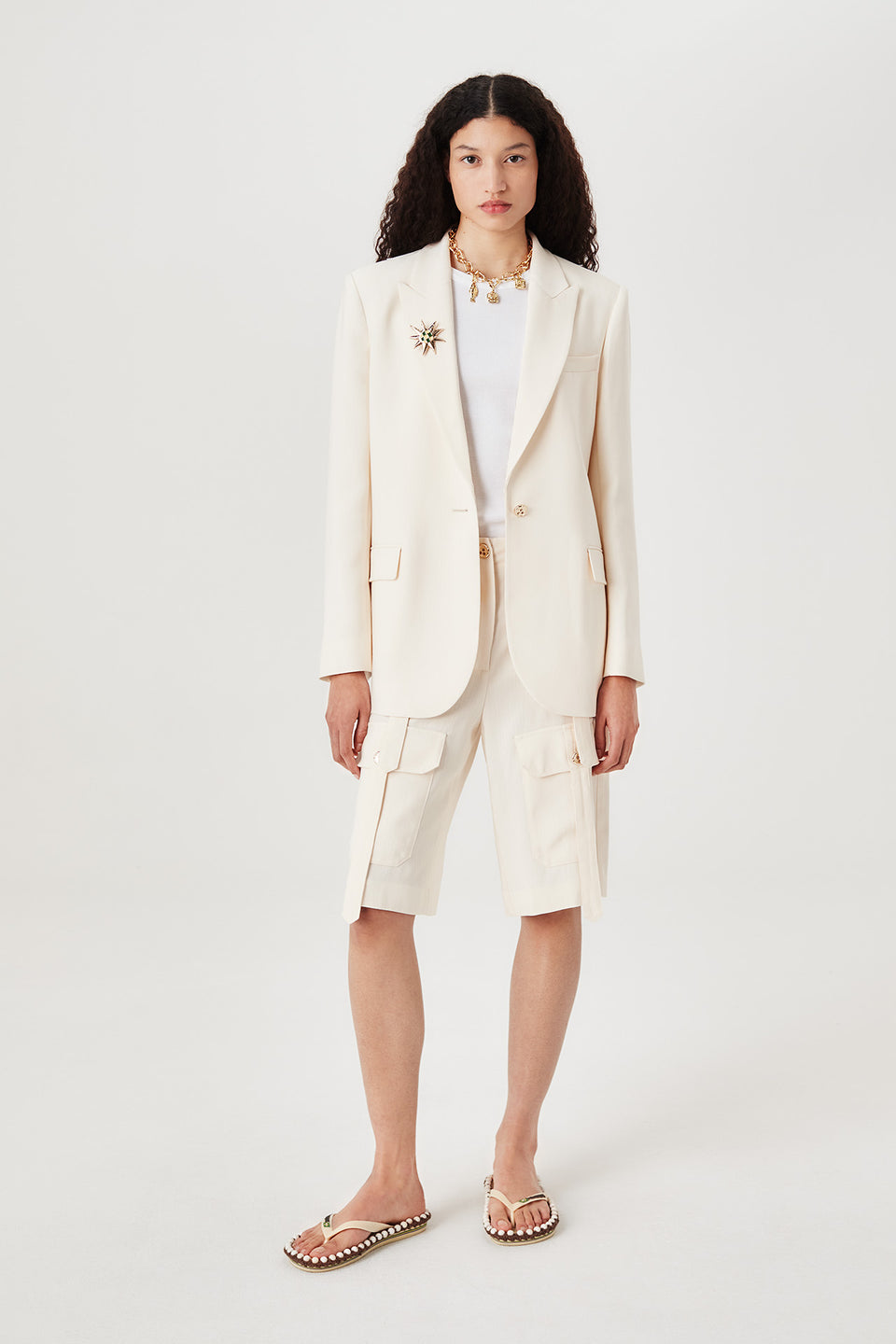 Veste tailleur à broche soleil