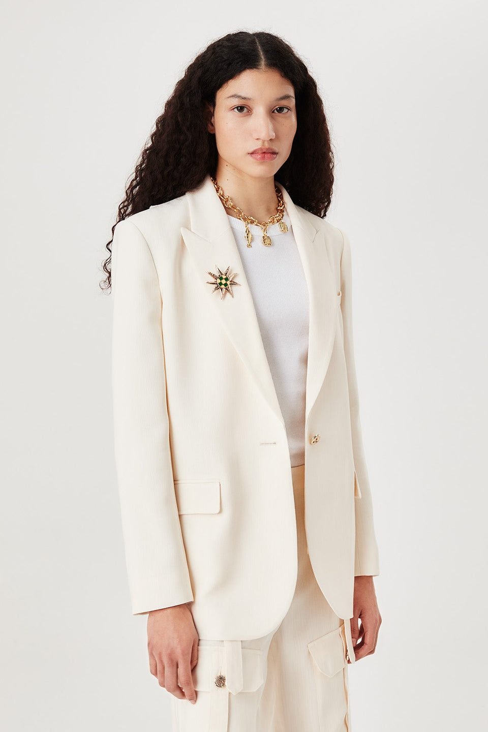 Veste tailleur à broche soleil