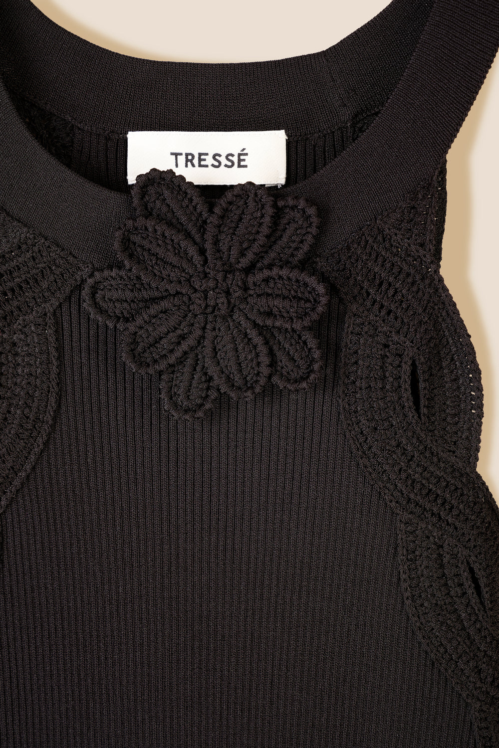 Knitted dress with crochet flower