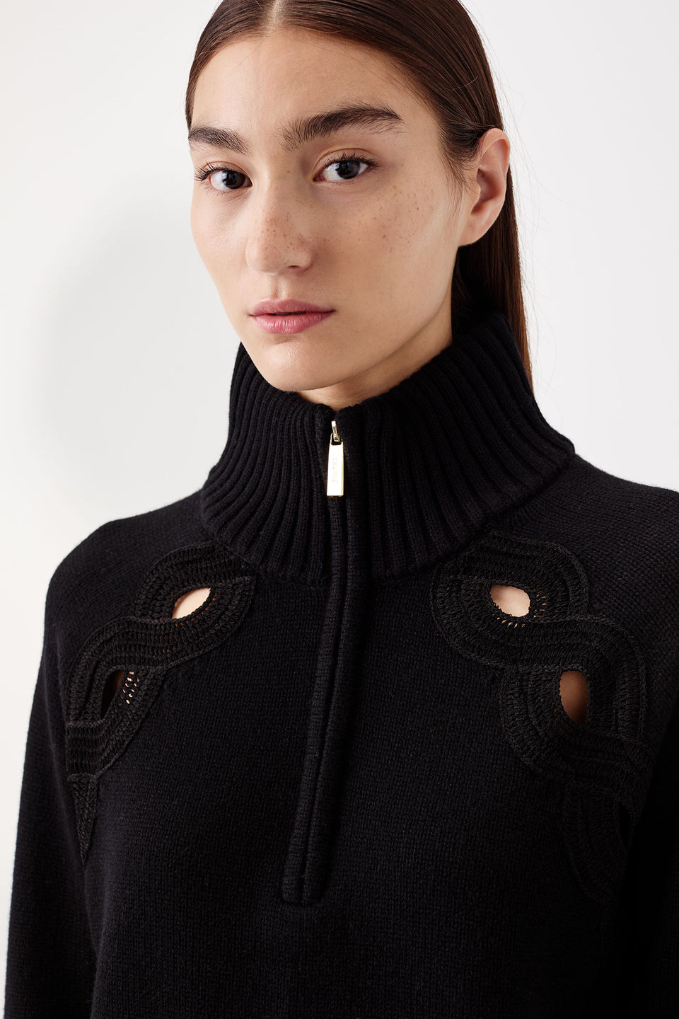 Sweater with braided opening