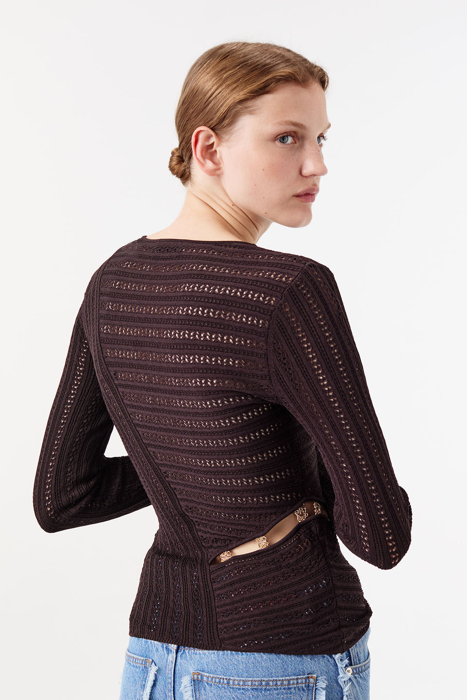 Knit top with asymmetrical cutouts