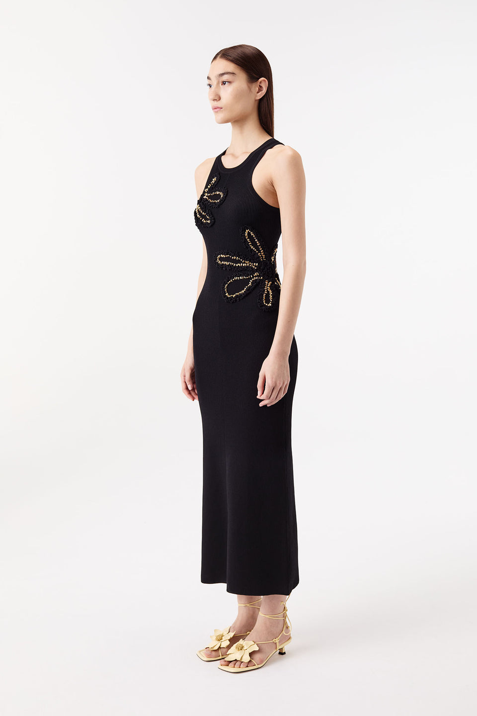 Dress with flowers embellished with gold jewelry