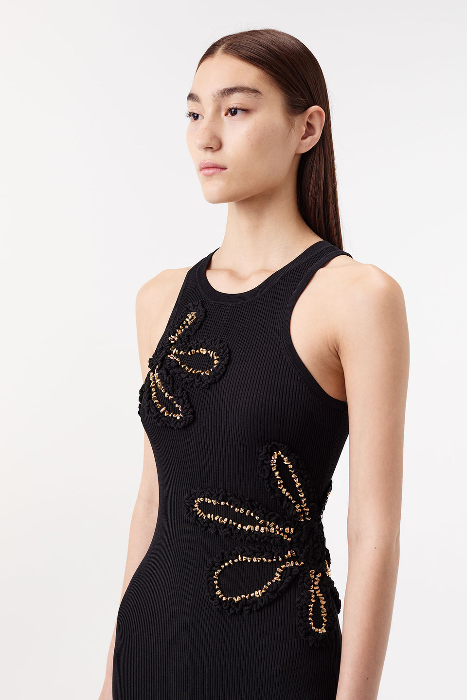 Dress with flowers embellished with gold jewelry