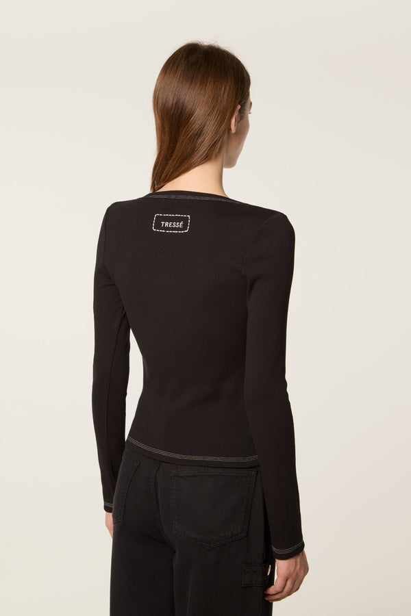 Top avec broche fleur