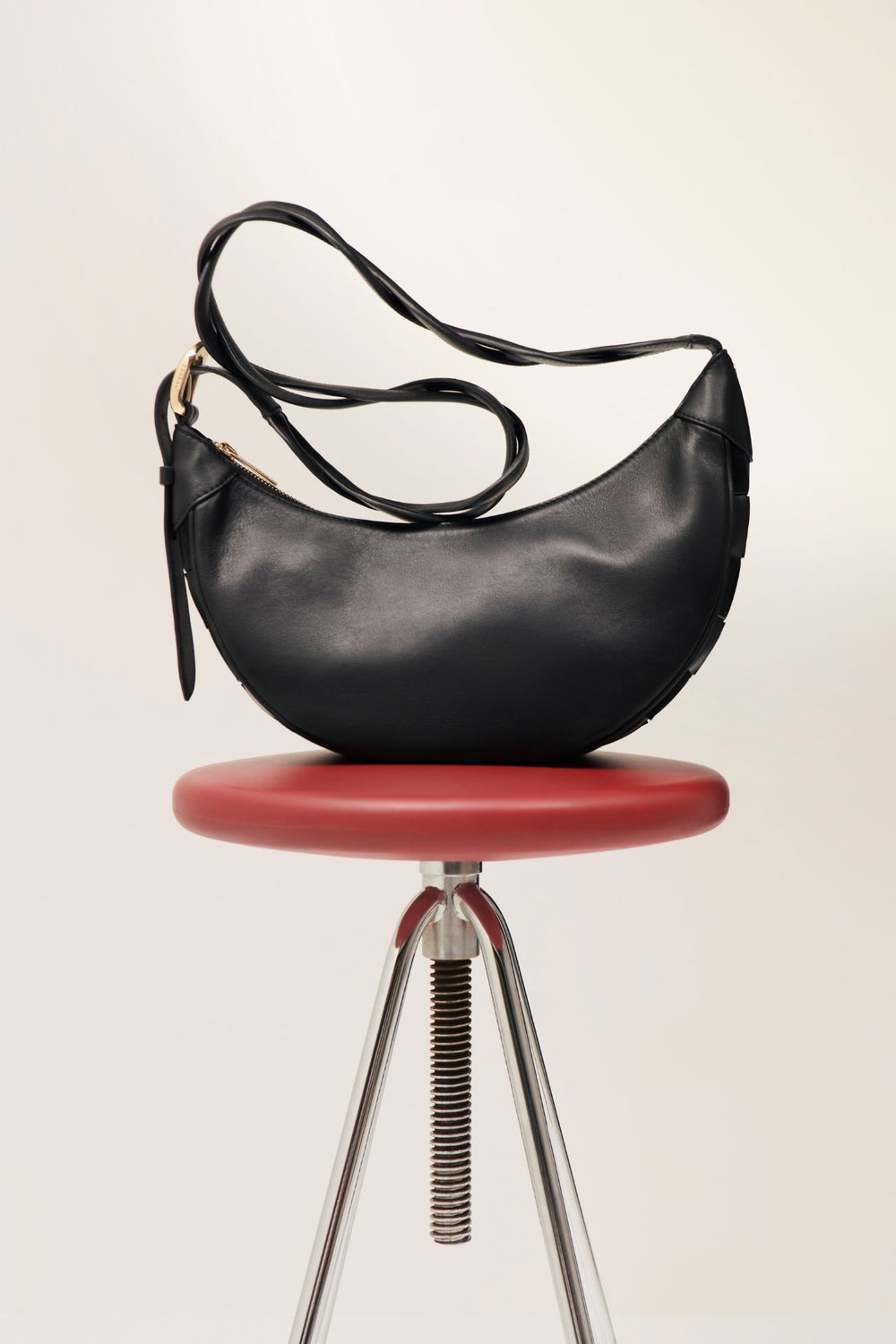 Sac bandoulière motif damier bi-matière