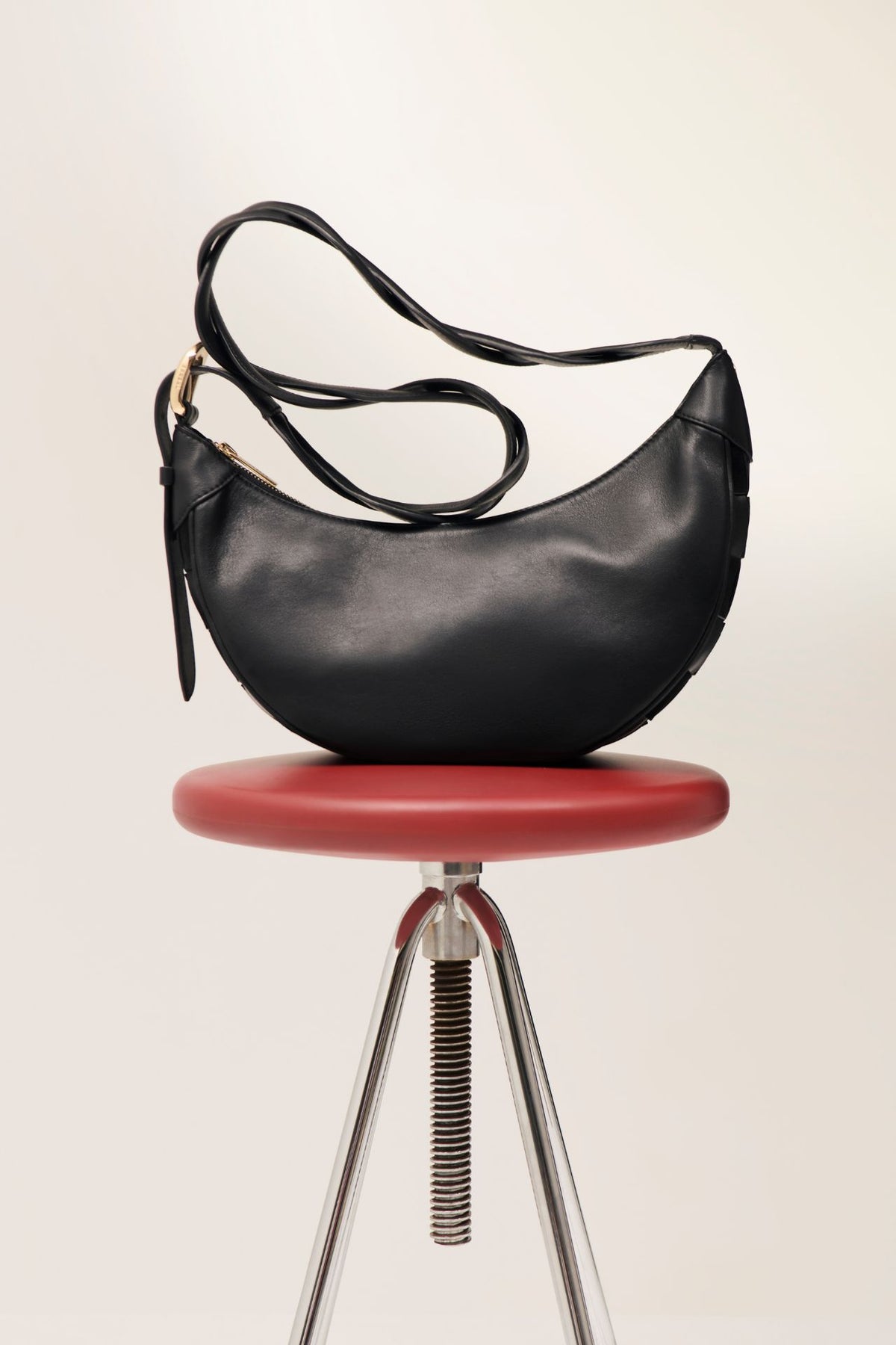 Bolso bandolera con motivo de damero bimateria