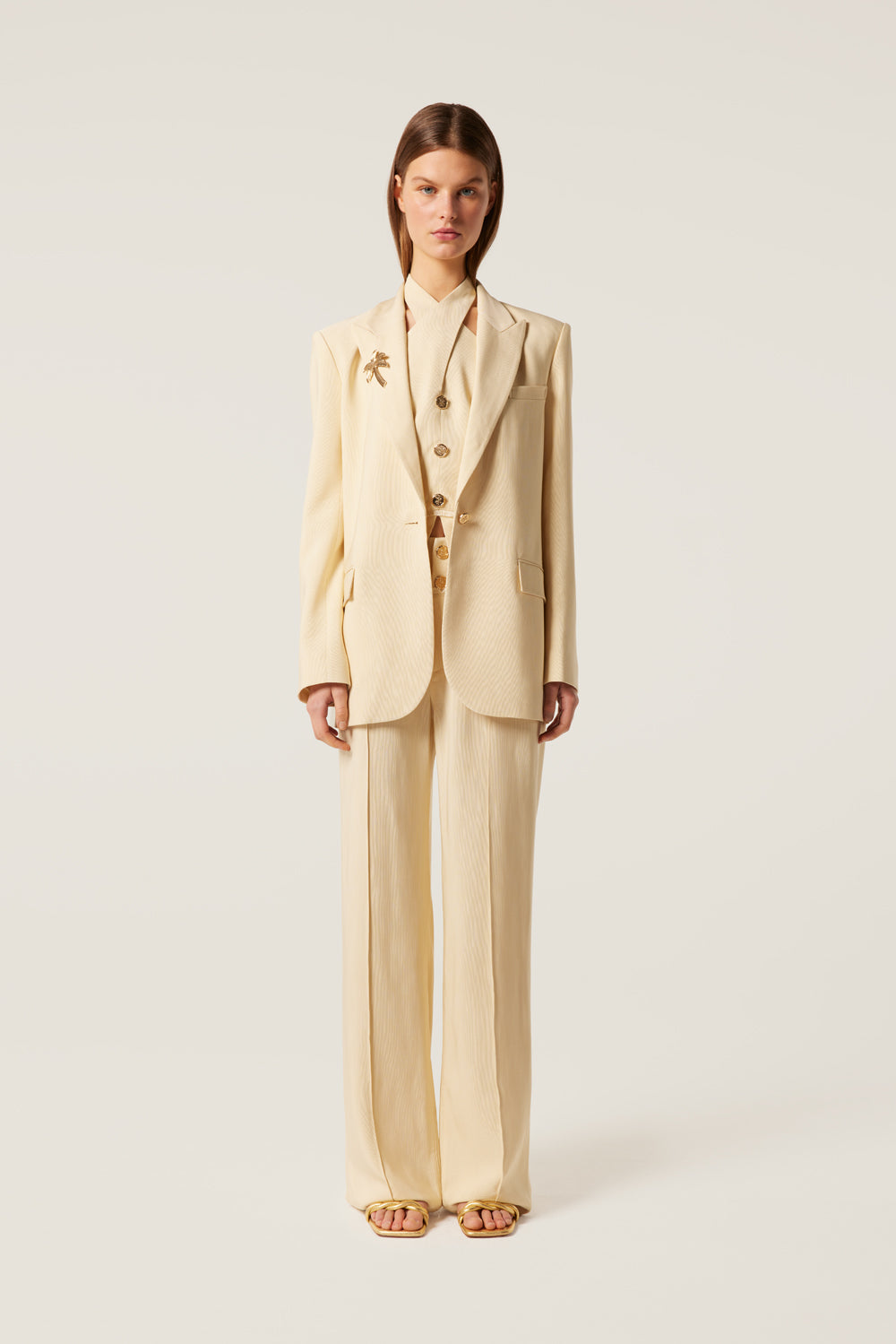 Tailored blazer with palm tree brooch