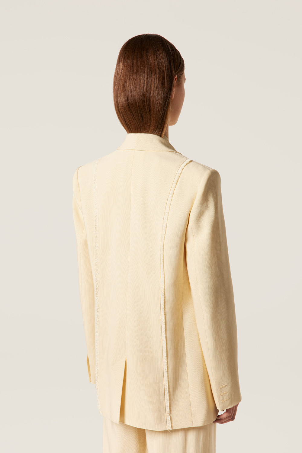 Tailored blazer with palm tree brooch