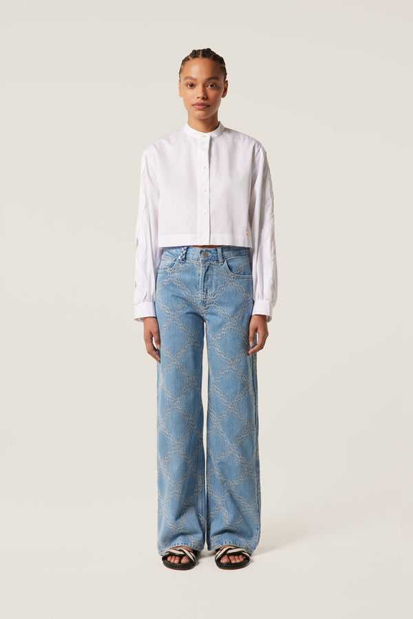 Denim with embroidered braids