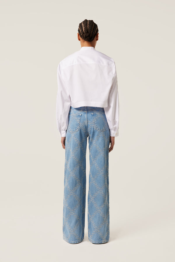 Denim with embroidered braids