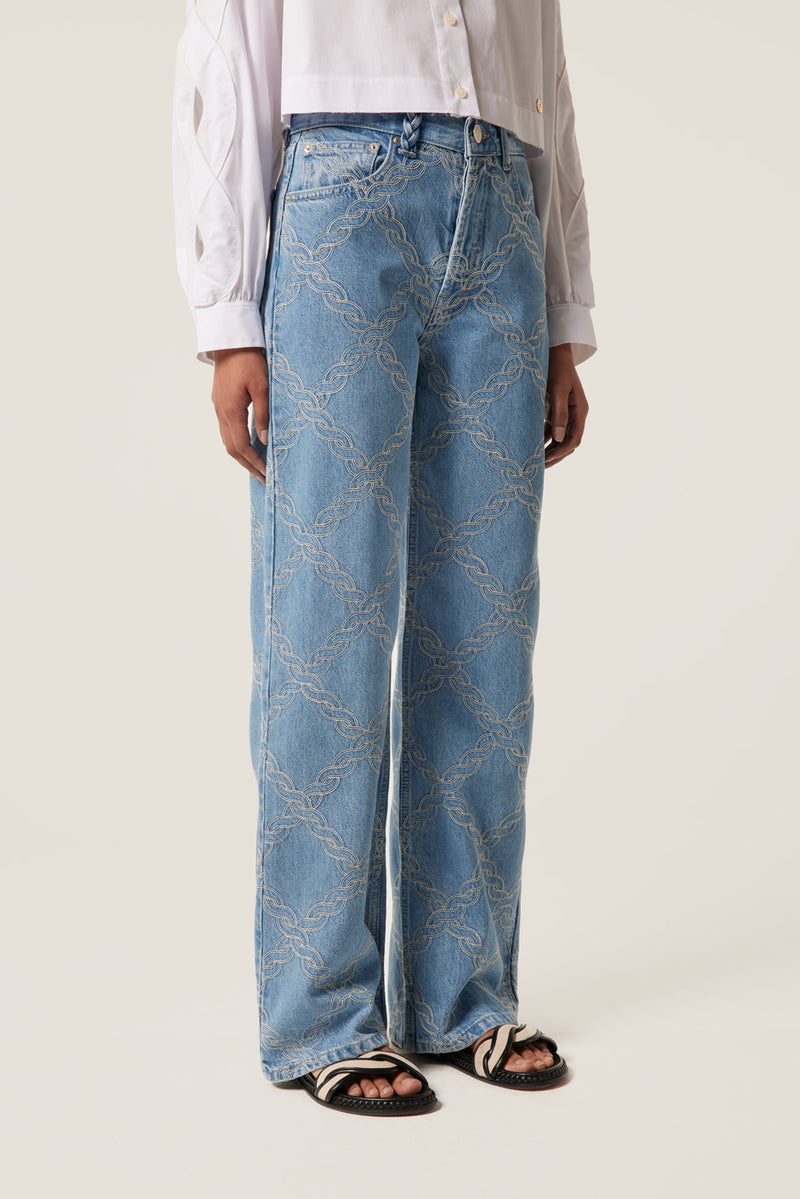 Denim with embroidered braids