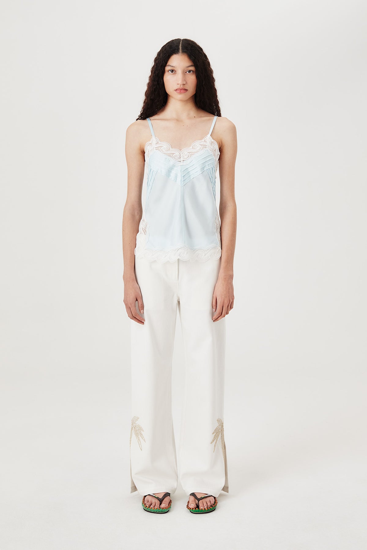 Pants with embroidered rhinestone palm tree