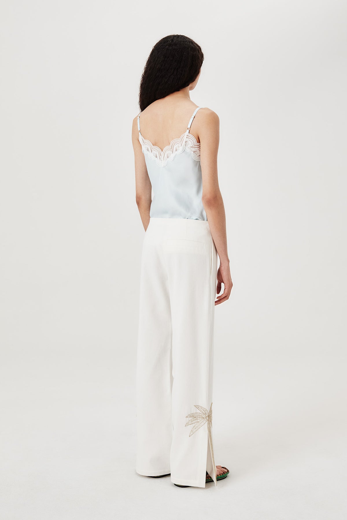 Pants with embroidered rhinestone palm tree