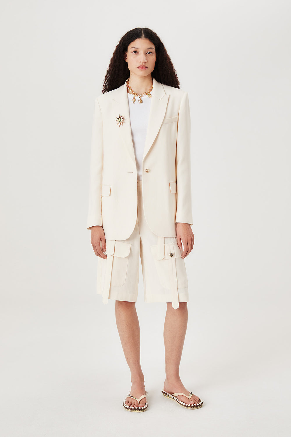 Tailored jacket with palm brooch