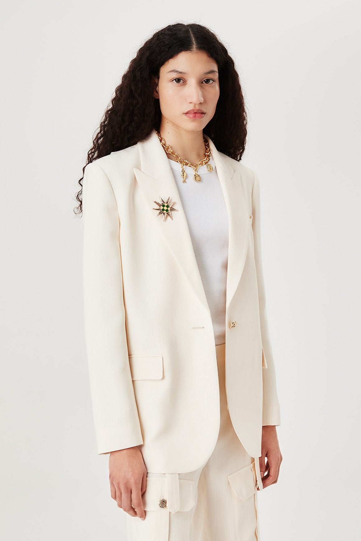 Veste tailleur à broche soleil