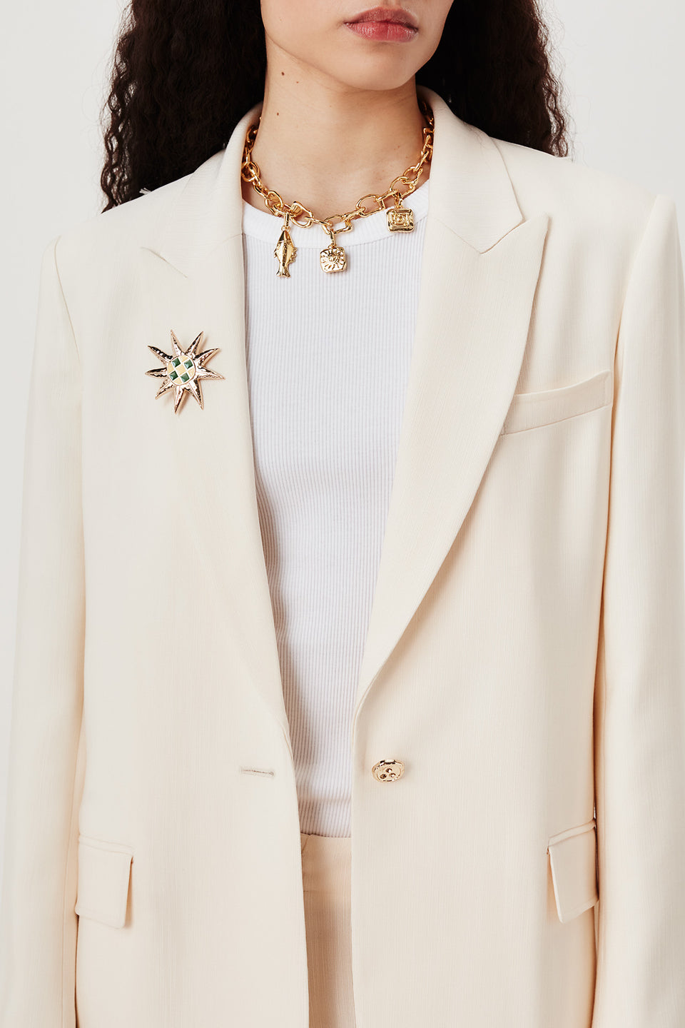 Veste tailleur à broche soleil