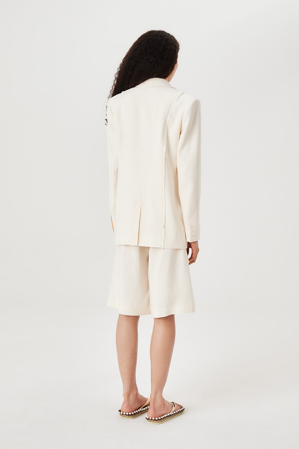 Tailored jacket with palm brooch