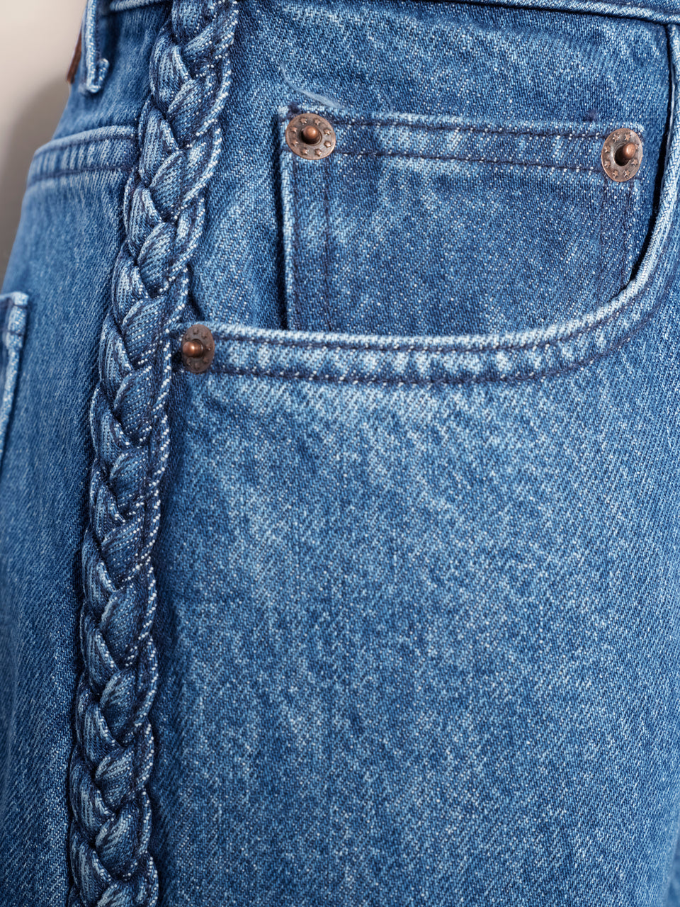 Denim with applied braids