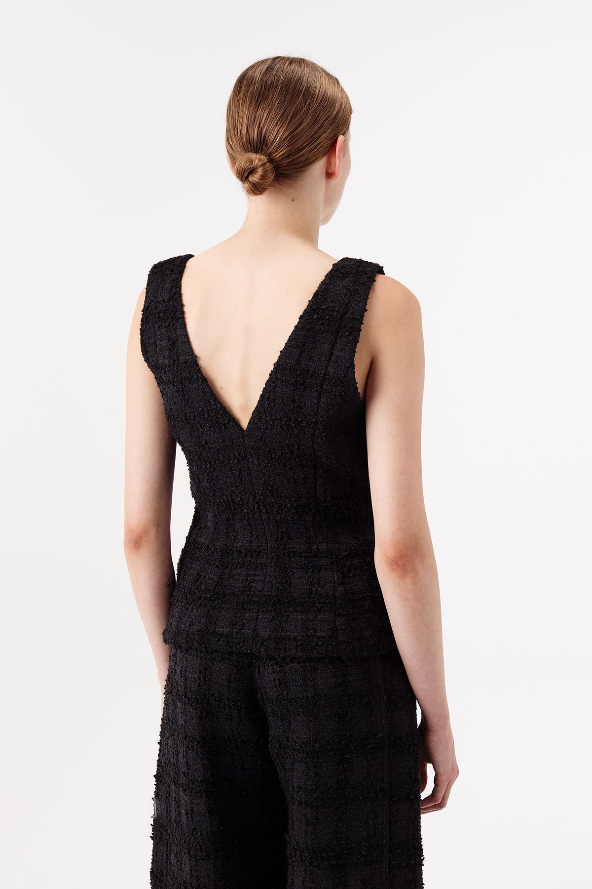 Tweed top with gold brooch