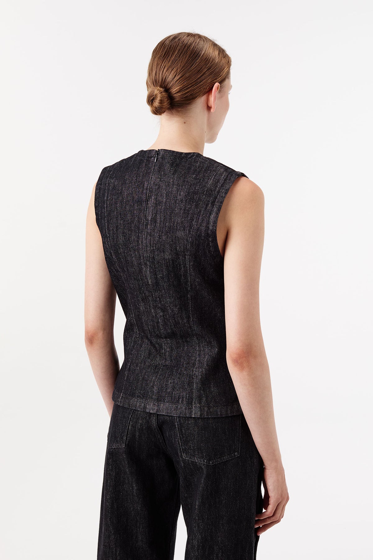 Vest with wave button tab