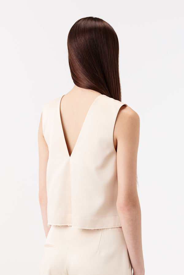 Satin top with a braided opening
