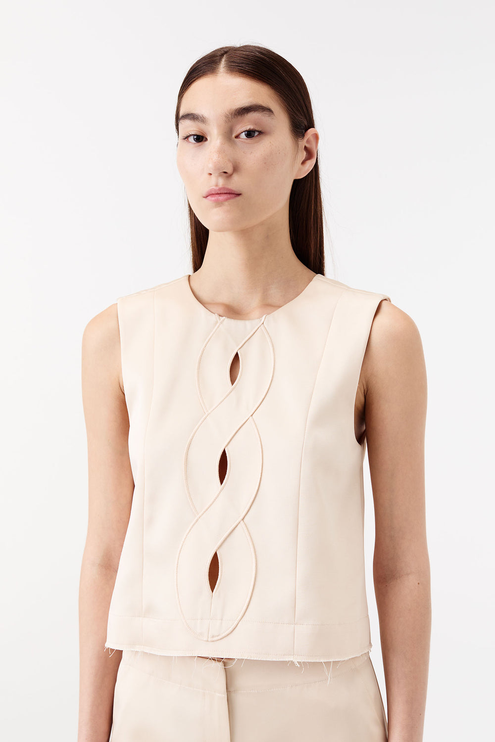 Satin top with a braided opening