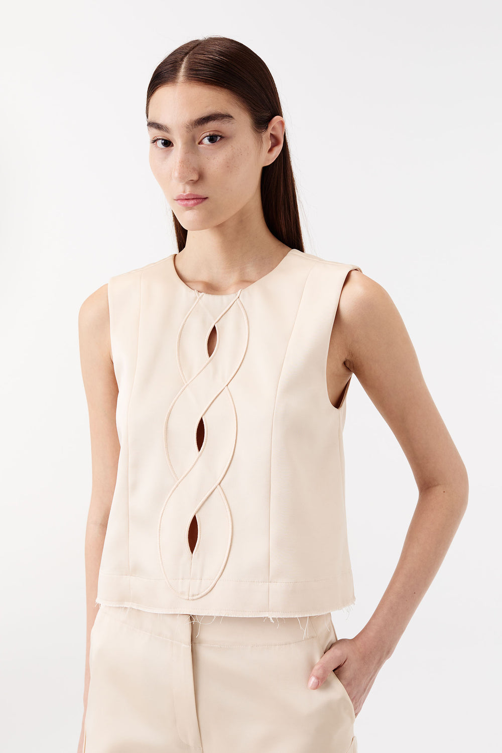 Satin top with a braided opening