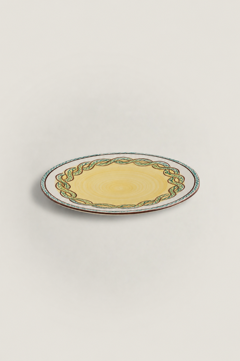 Dinner plate with braided pattern