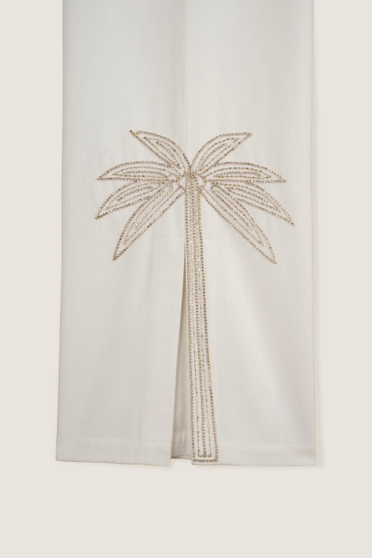 Pants with embroidered rhinestone palm tree
