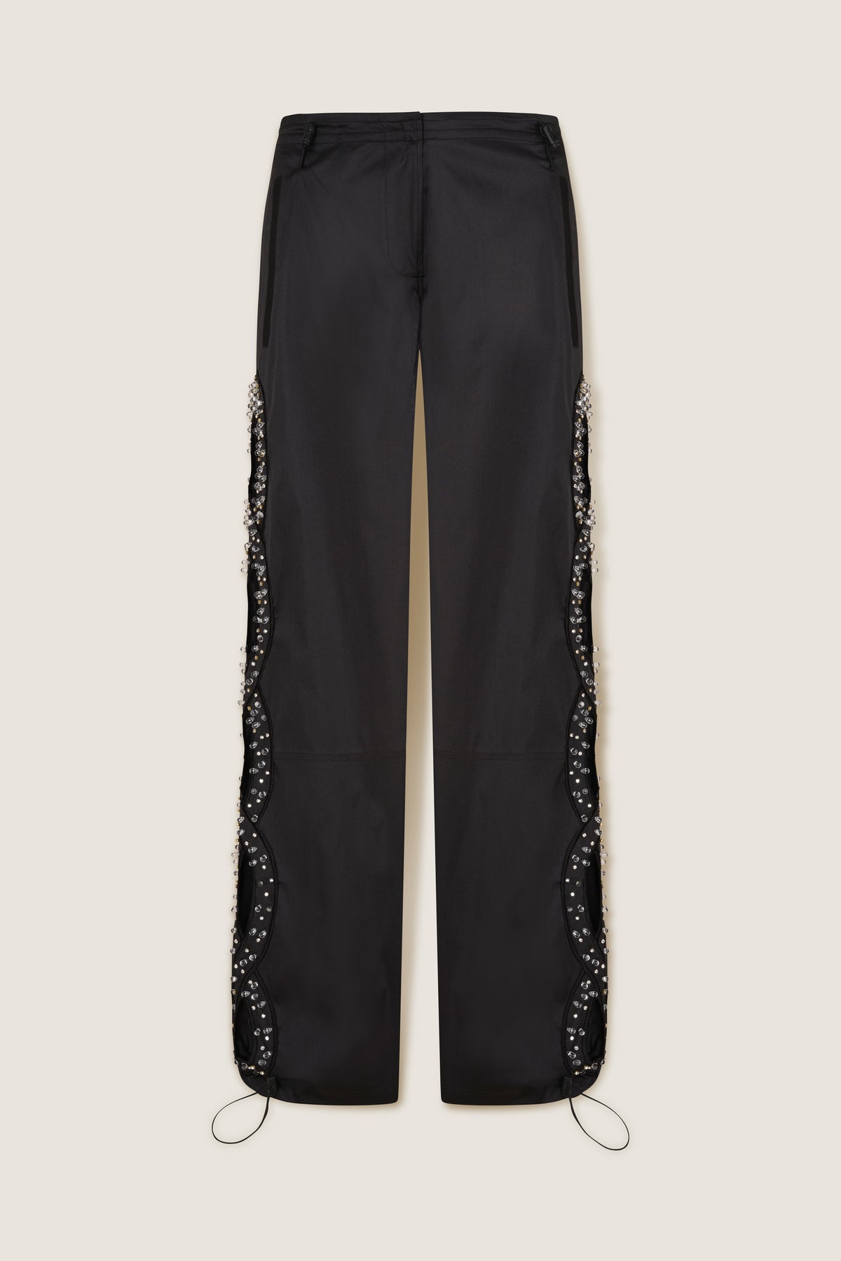 Trousers with rhinestone-embroidered braids