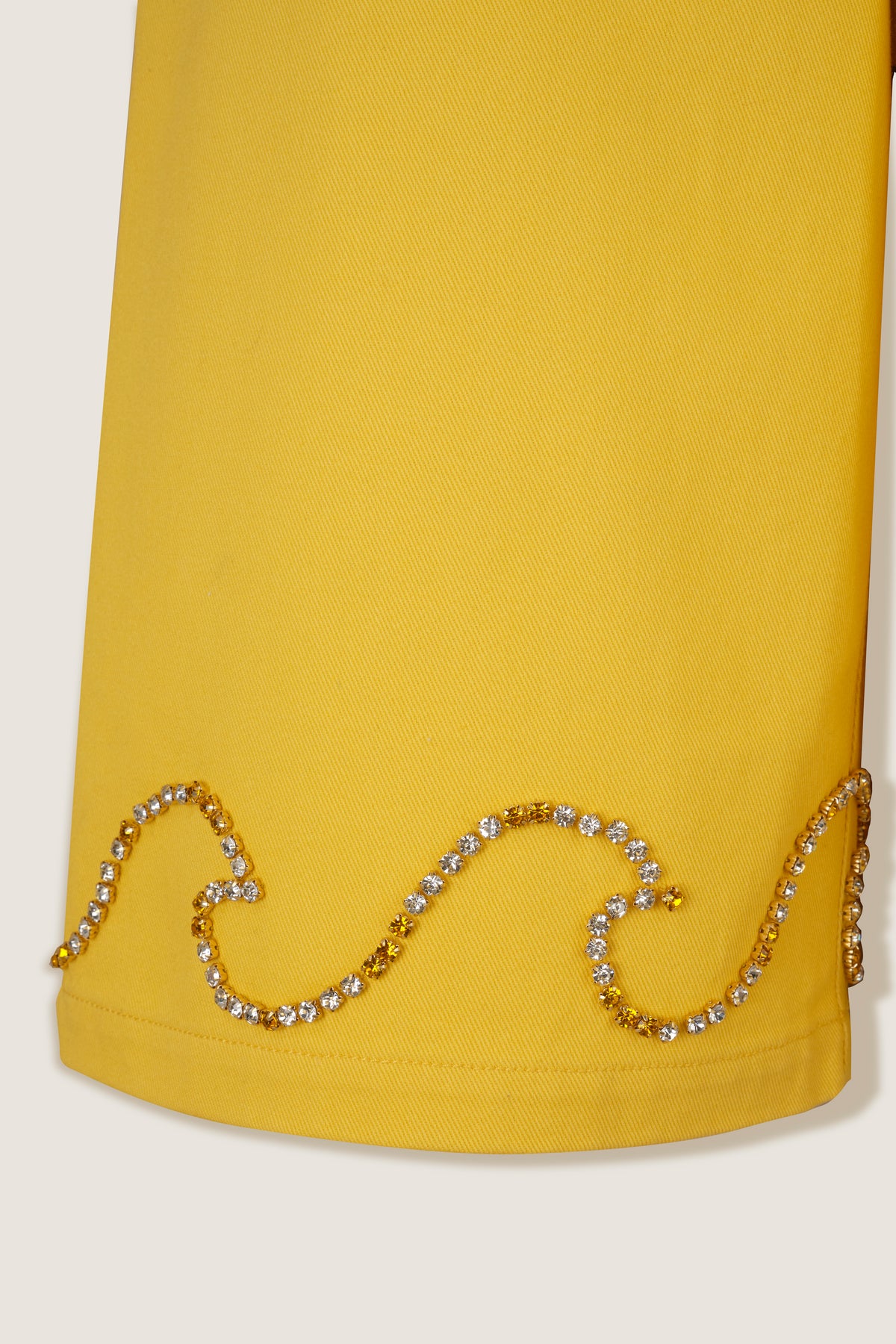 Bermuda shorts with rhinestone wave motif