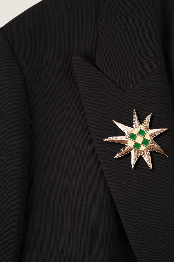 Tailored jacket with palm brooch