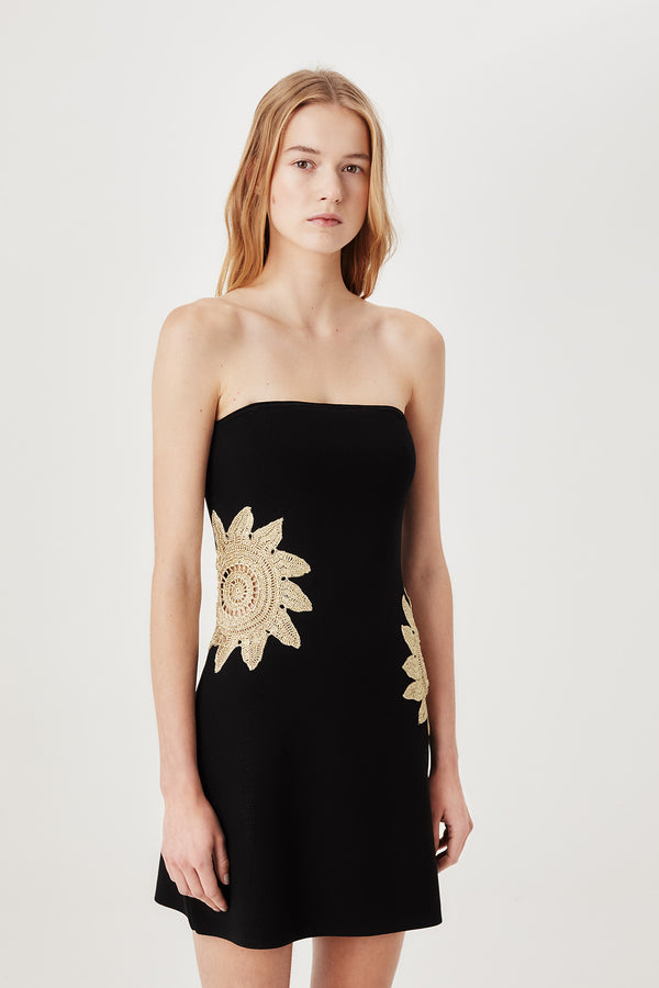 Short knit dress with openwork sunburst detailing