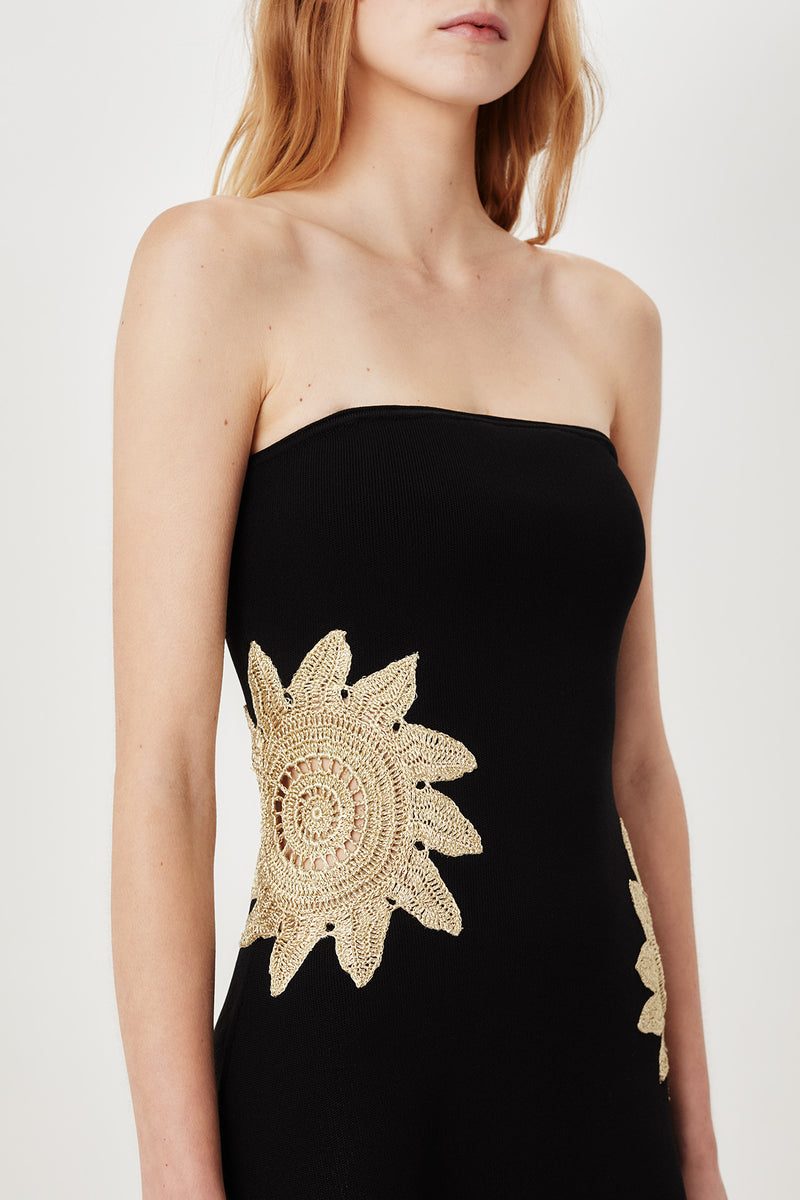 Short knit dress with openwork sunburst detailing