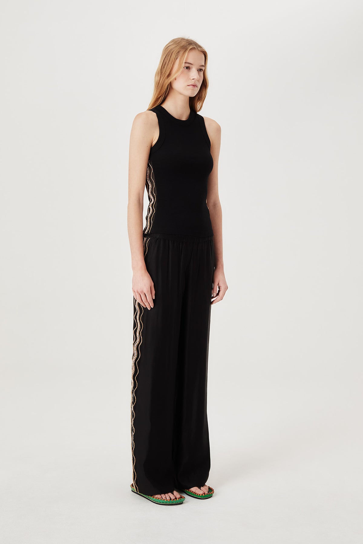 Pants with embroidered rhinestones