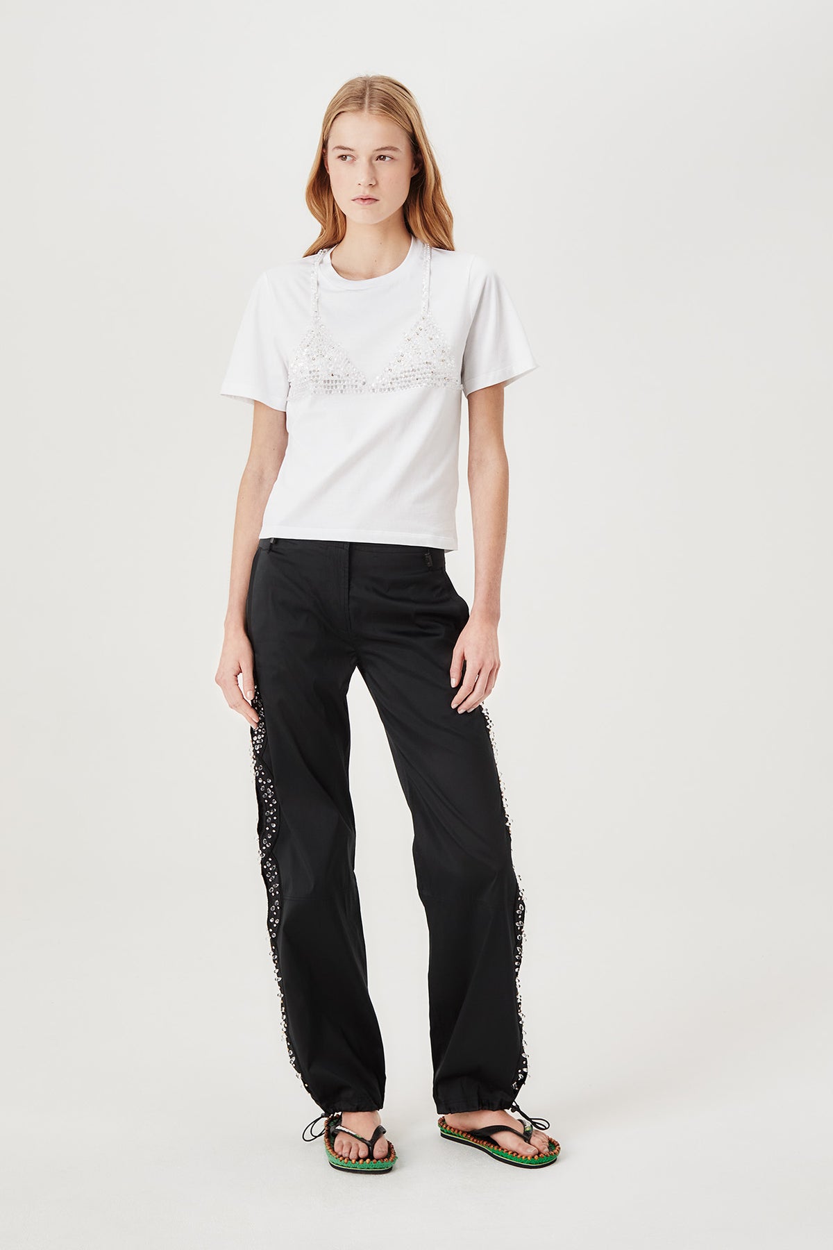 Trousers with rhinestone-embroidered braids