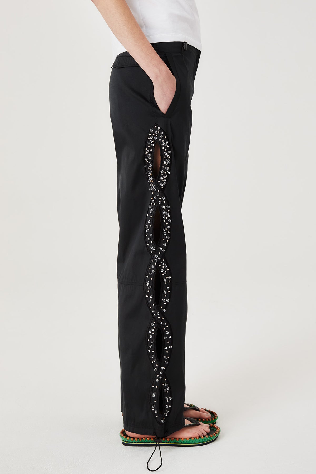 Trousers with rhinestone-embroidered braids