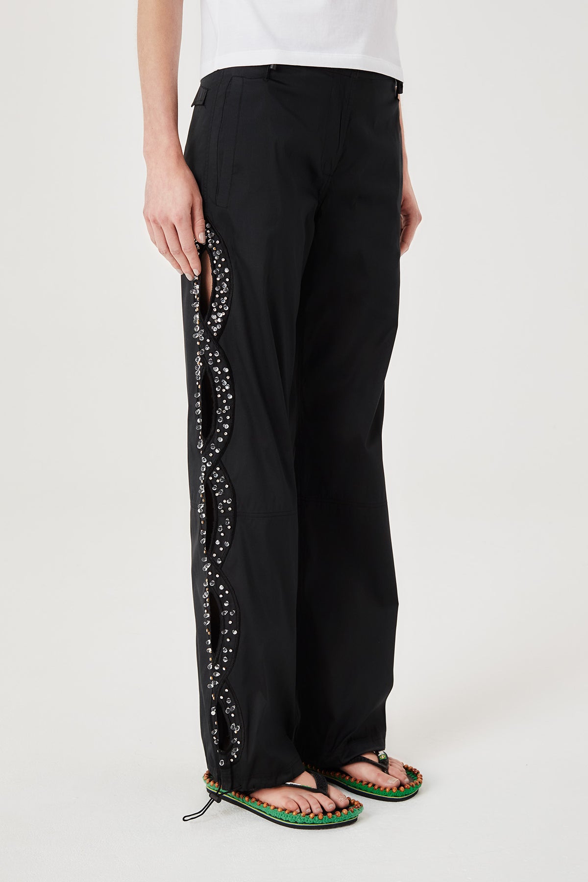 Trousers with rhinestone-embroidered braids