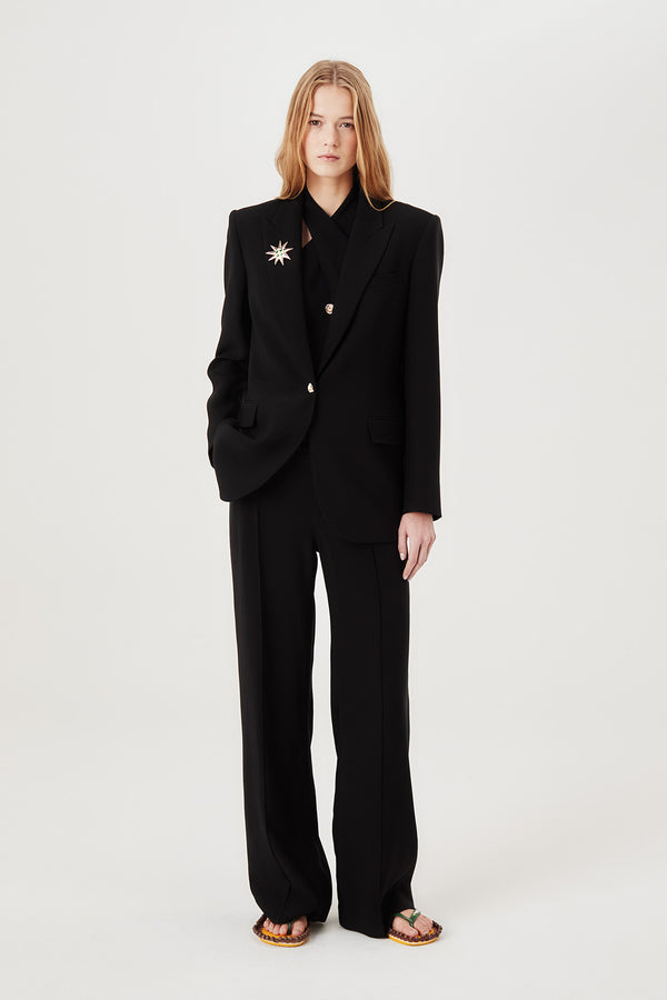 Tailored jacket with palm brooch