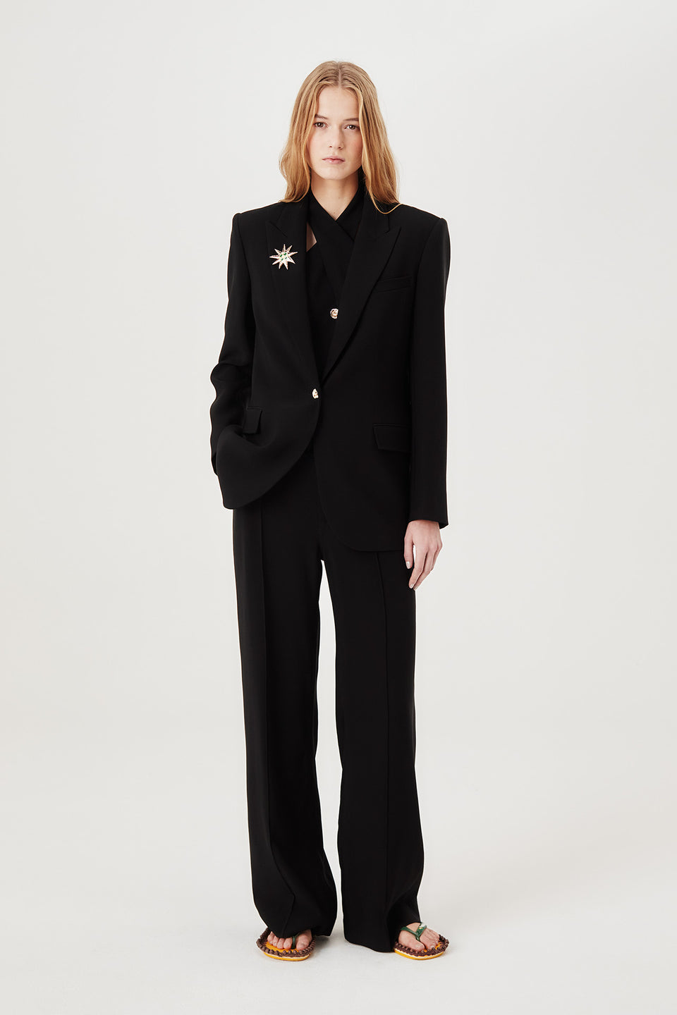 Veste tailleur à broche soleil