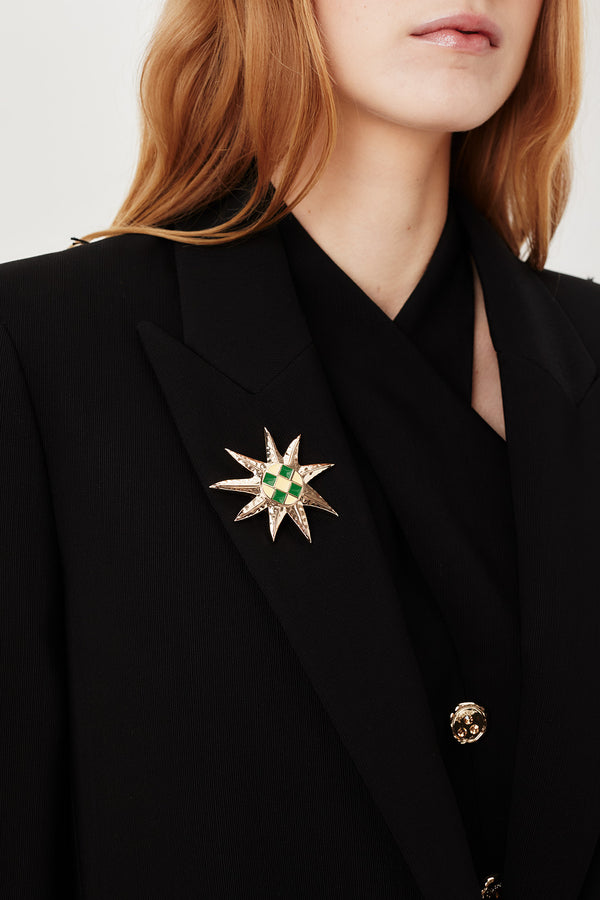 Tailored jacket with palm brooch