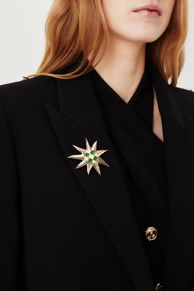 Tailored jacket with palm brooch