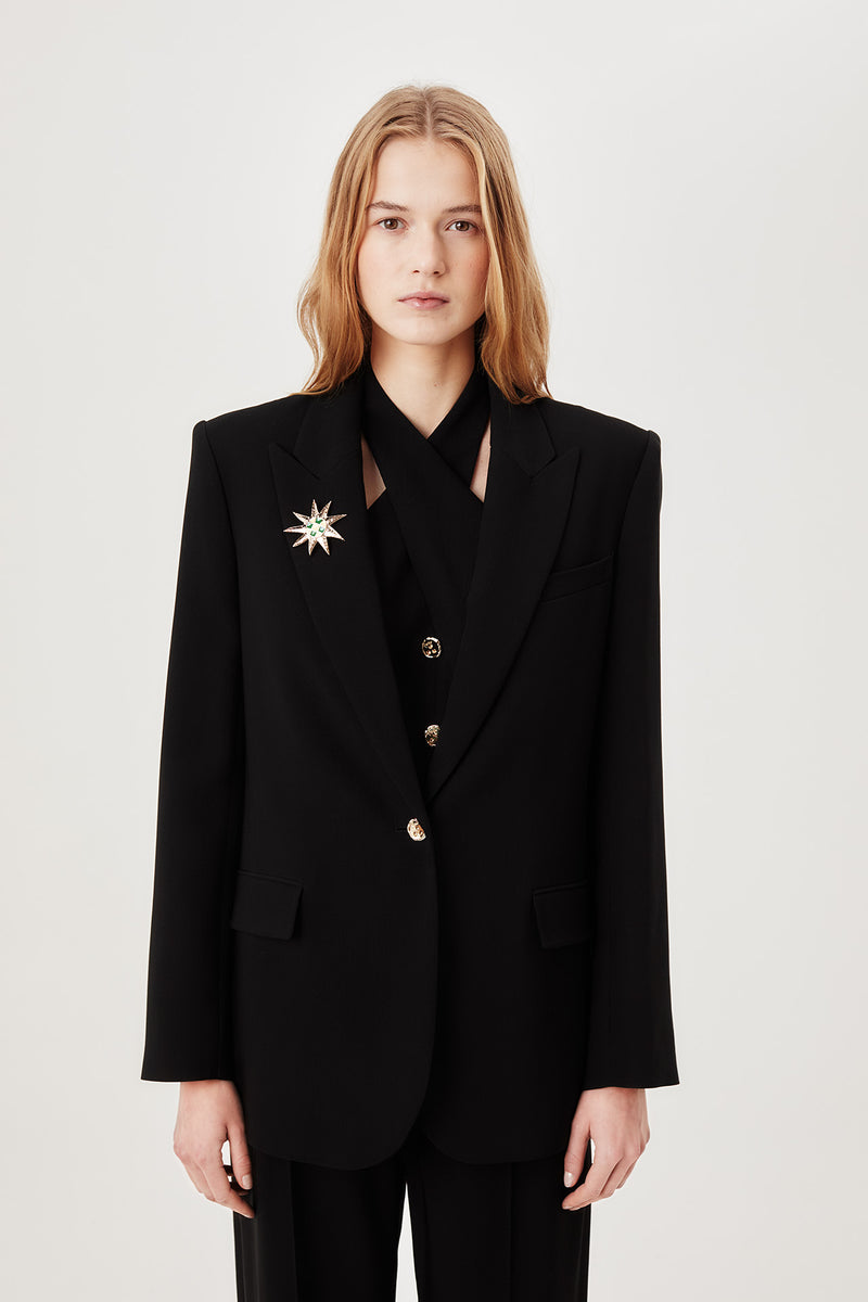 Tailored jacket with palm brooch
