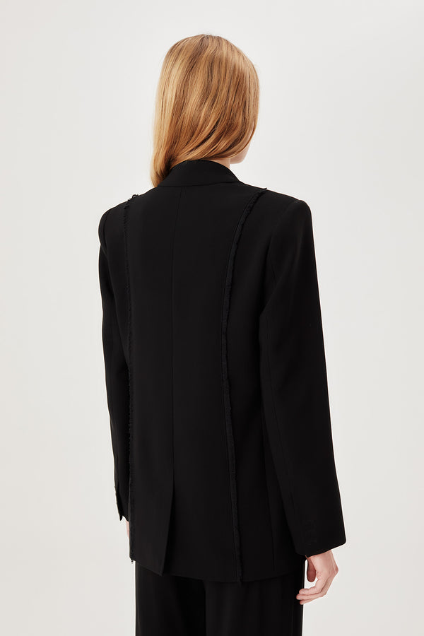 Tailored jacket with palm brooch