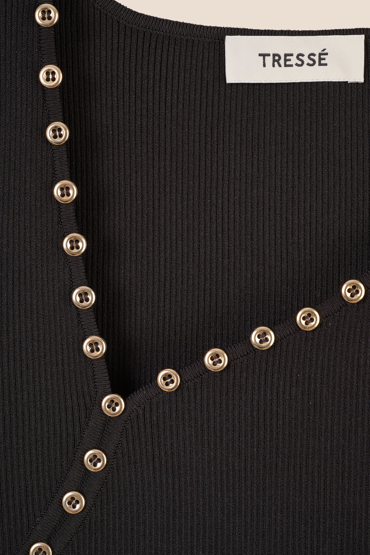 Top in maglia con scollo asimmetrico