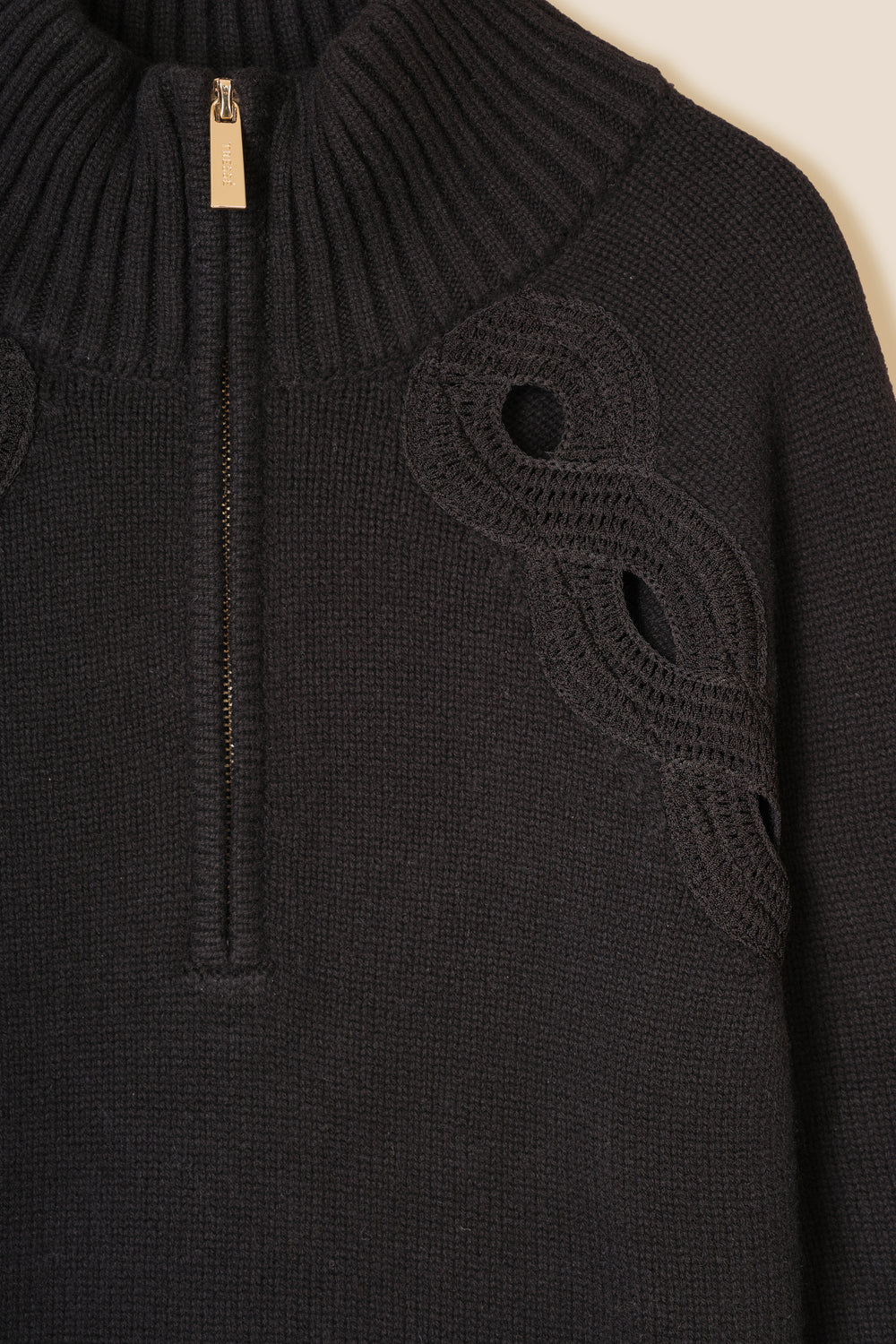 Braided opening sweater