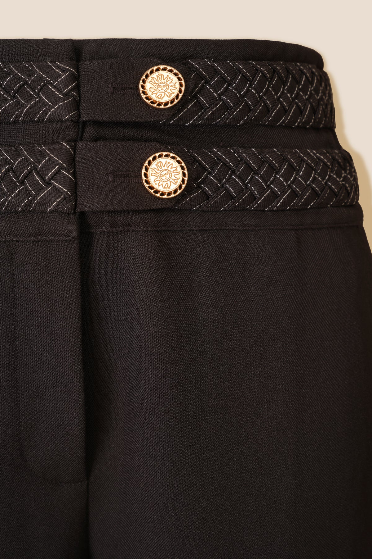 Pantalon avec ceinture tresse