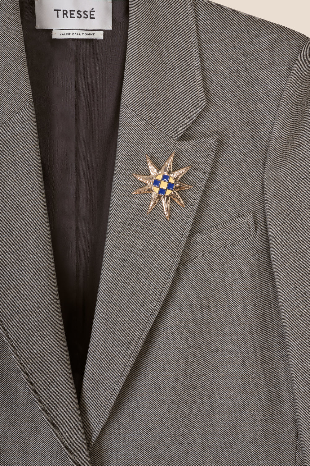 Tailored jacket with brooch