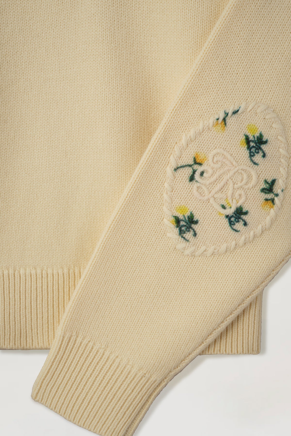 Sweater with floral elbow patches