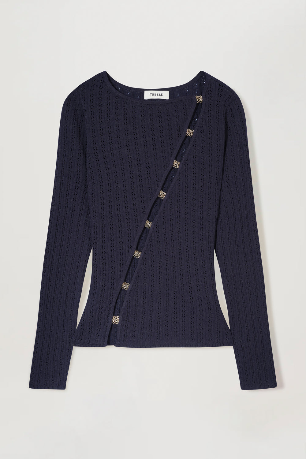 Knit top with an opening and gold jewelry